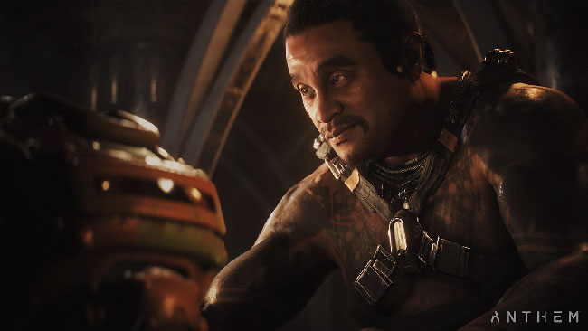 Screenshot of “Anthem,” featuring one of the NPC team members that will support the player character. Image depicts a heavily tattooed man.