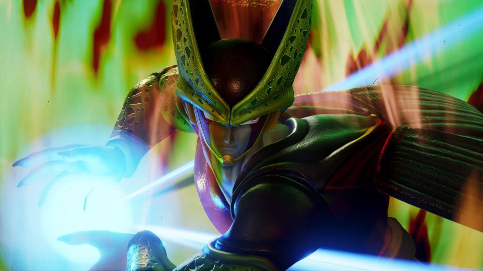 “Jump Force” screenshot of Cell, a green chimera-like and insectoid character, charging a powerful energy blast with his hands.